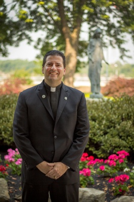 picture of father Maher, president of NU in ontario