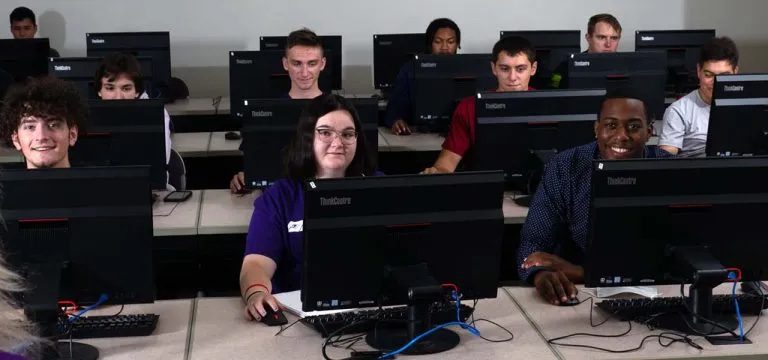 Students sitting at computers in a computer lab