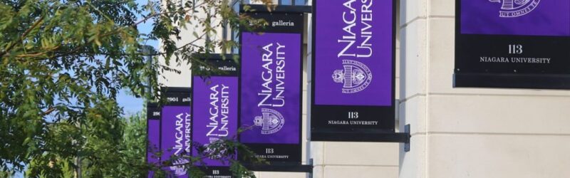 NU banners on the exterior of a building